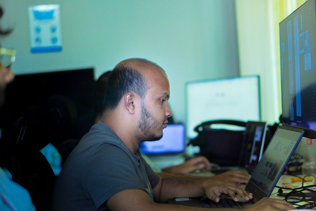 programmers coding in office